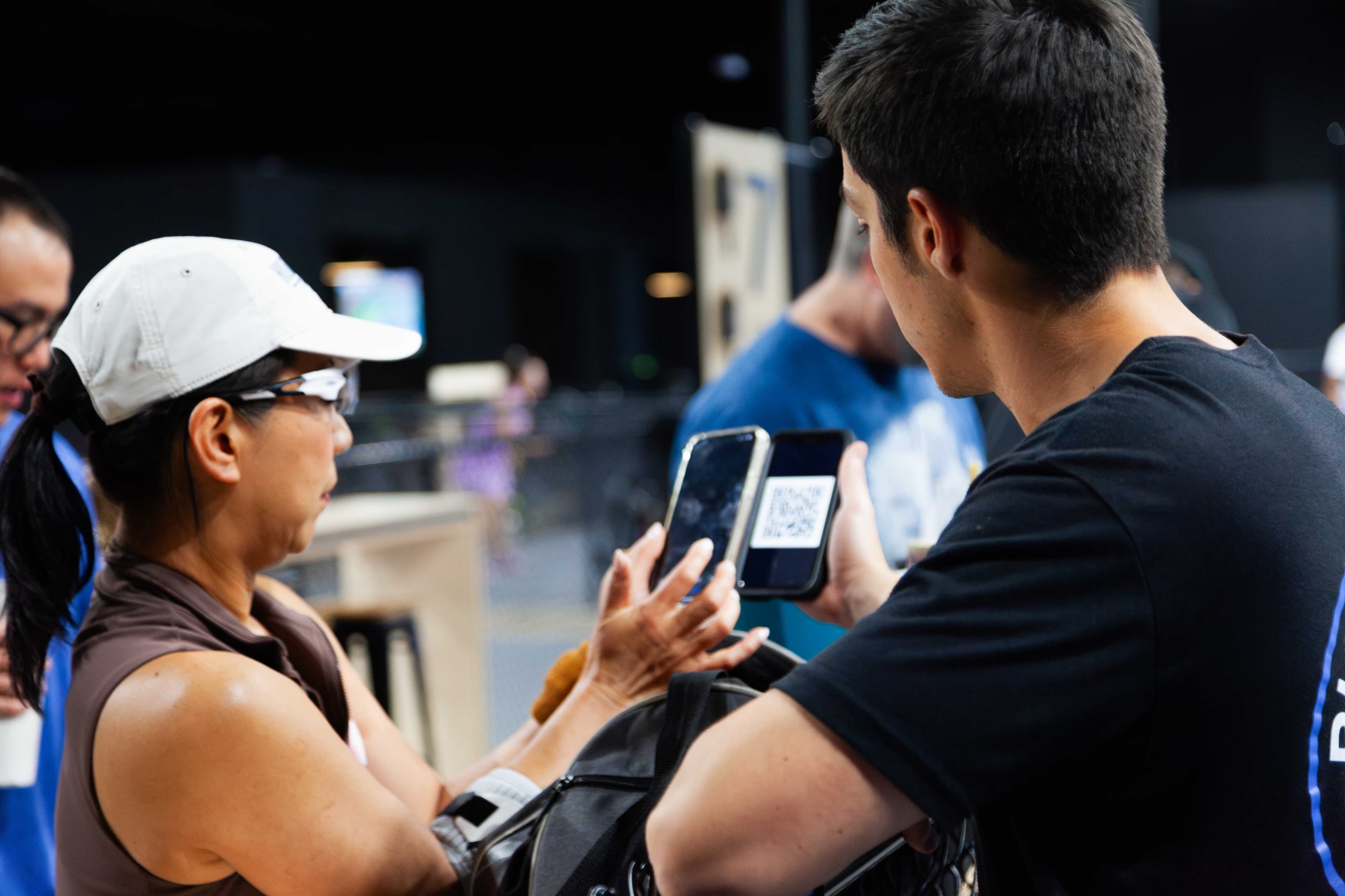 People interacting with smartphones